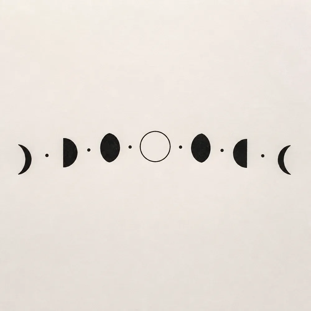 Seven solid black moon phases in a shallow arc, crescents at the ends, half and lens-shaped moons, an outline full moon in the middle, dots between.